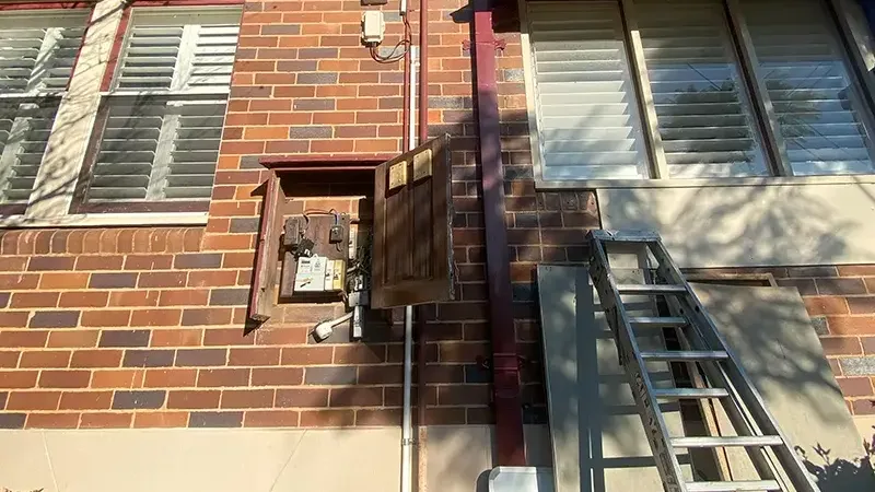 Meter box on the brick wall of a house